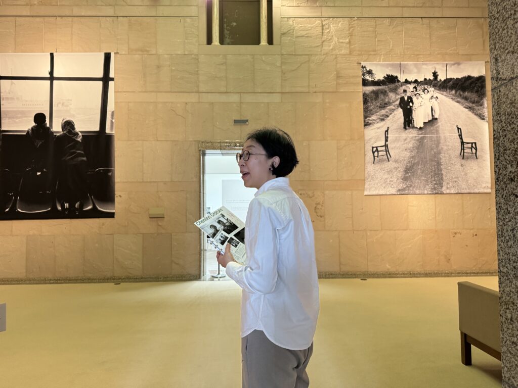 Artist Naho Kawabe is standing inside a museum building